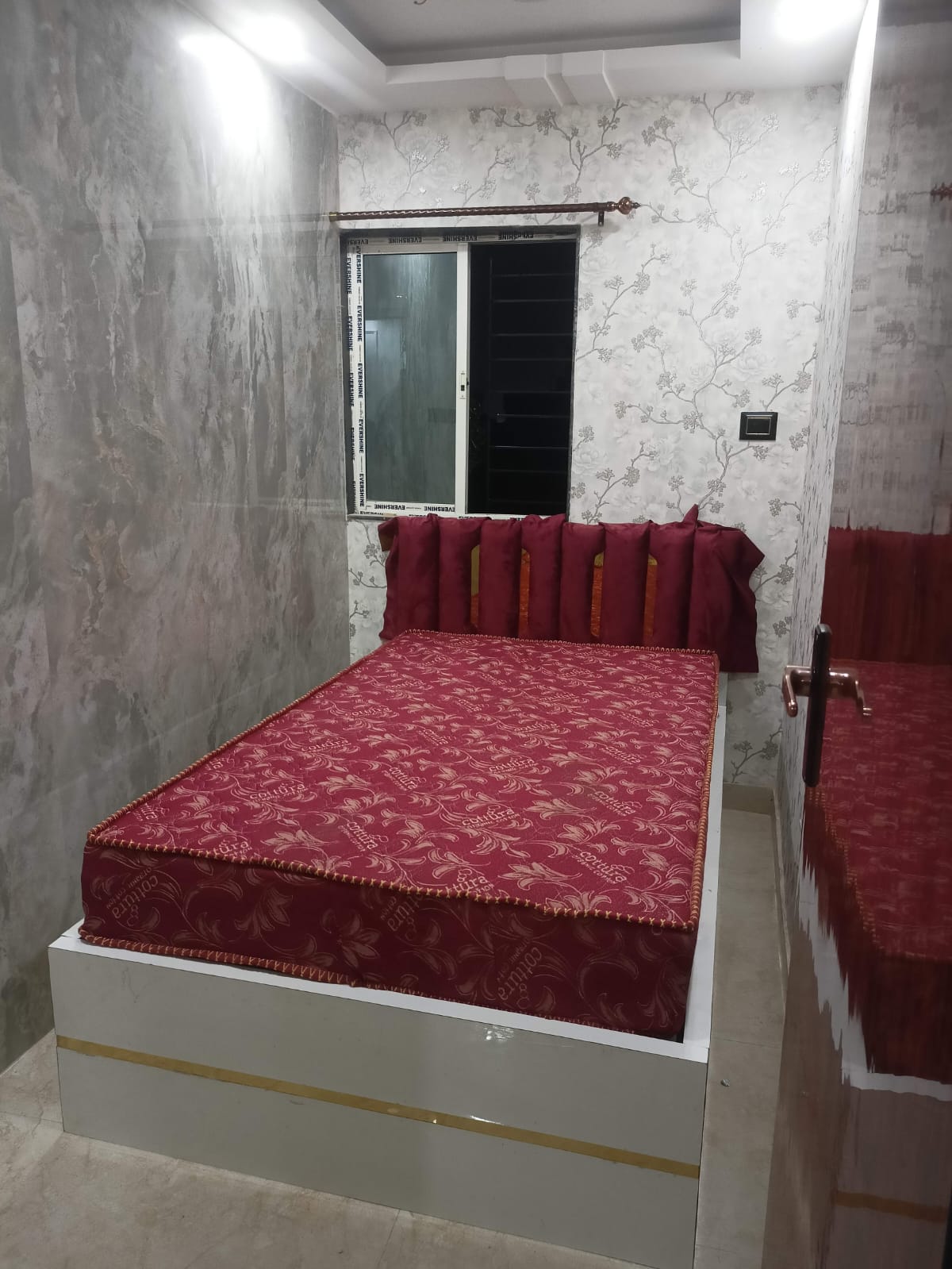 Bedroom with custom bed and wall finish