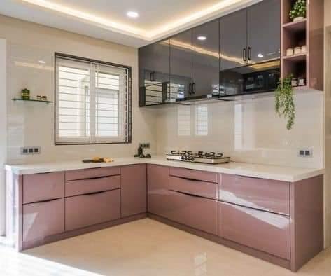 L-shaped modular kitchen with pink cabinets
