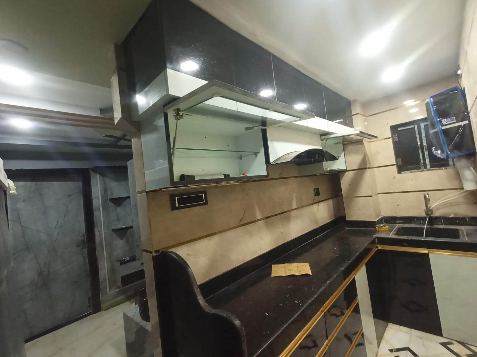 Black countertop modular kitchen work