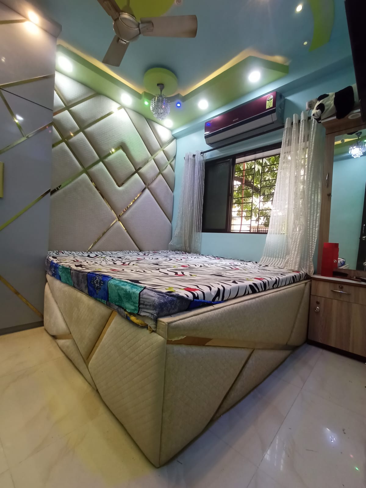 Bedroom interior with custom bed, headboard and ceiling design